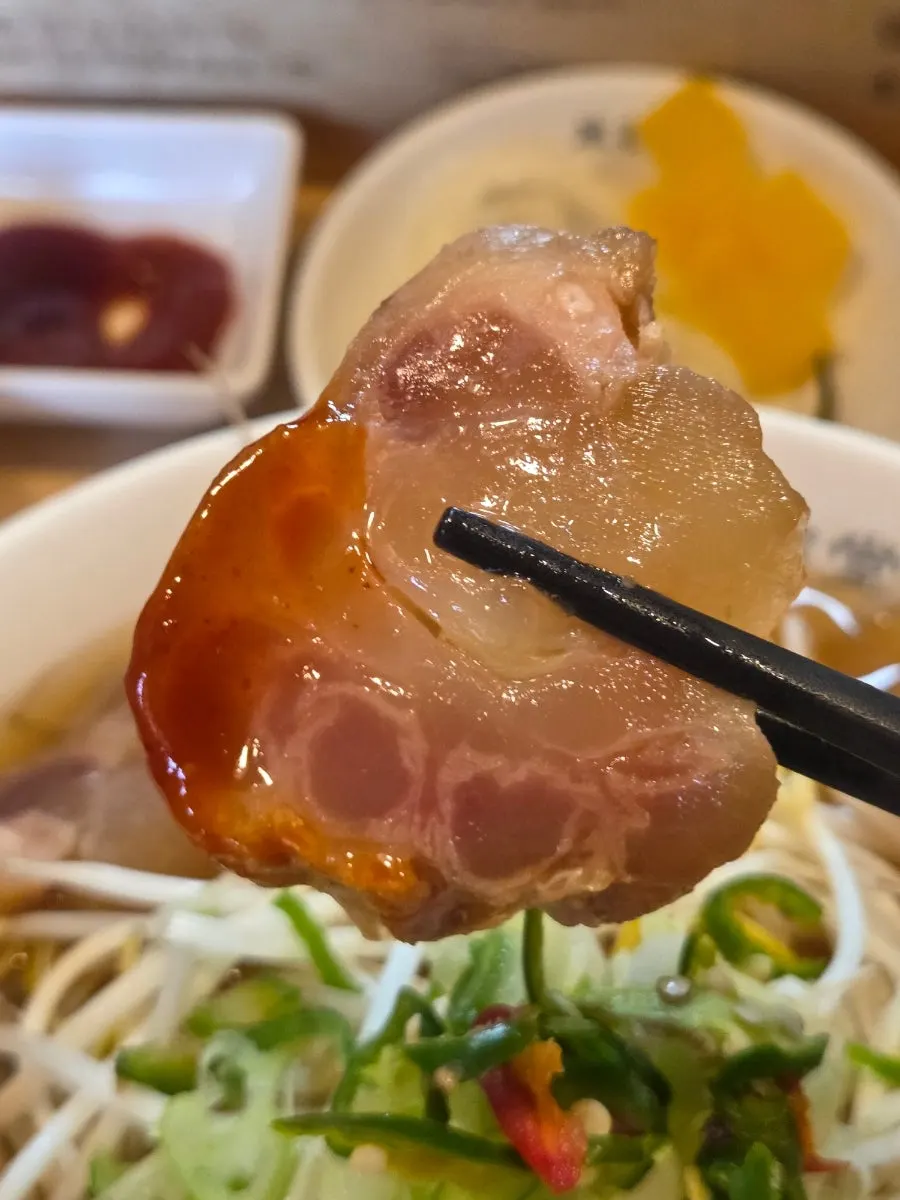 Tendon dipped in chili sauce