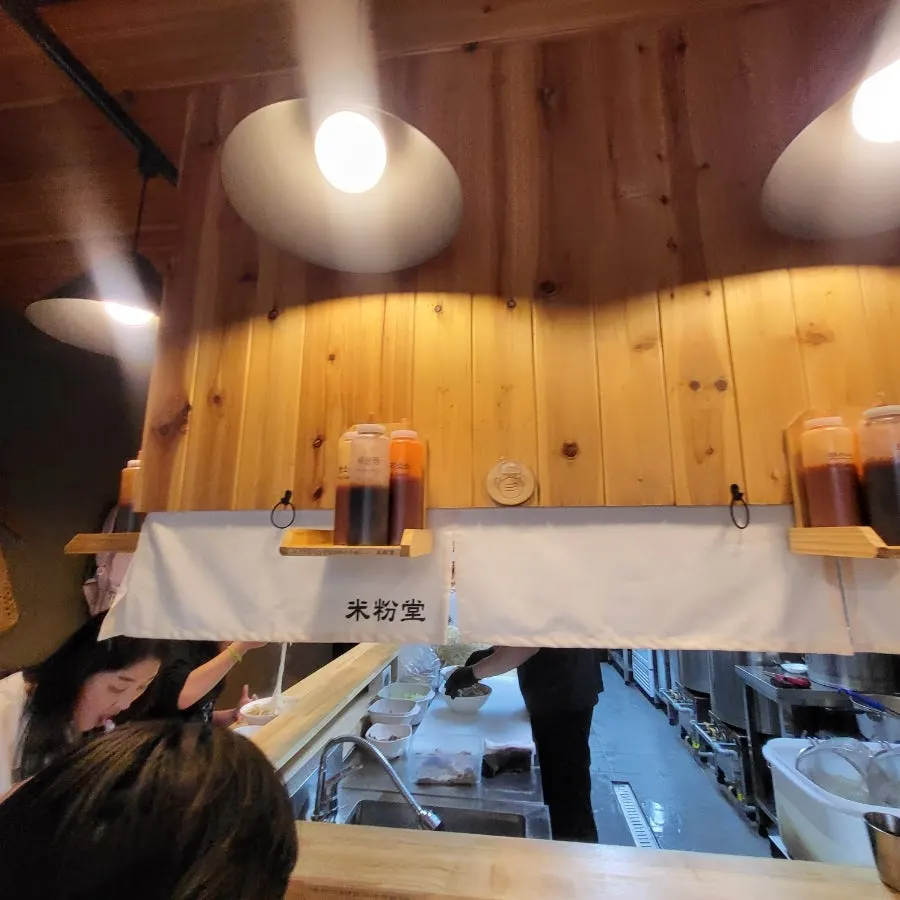 Bar-style seating facing the open kitchen