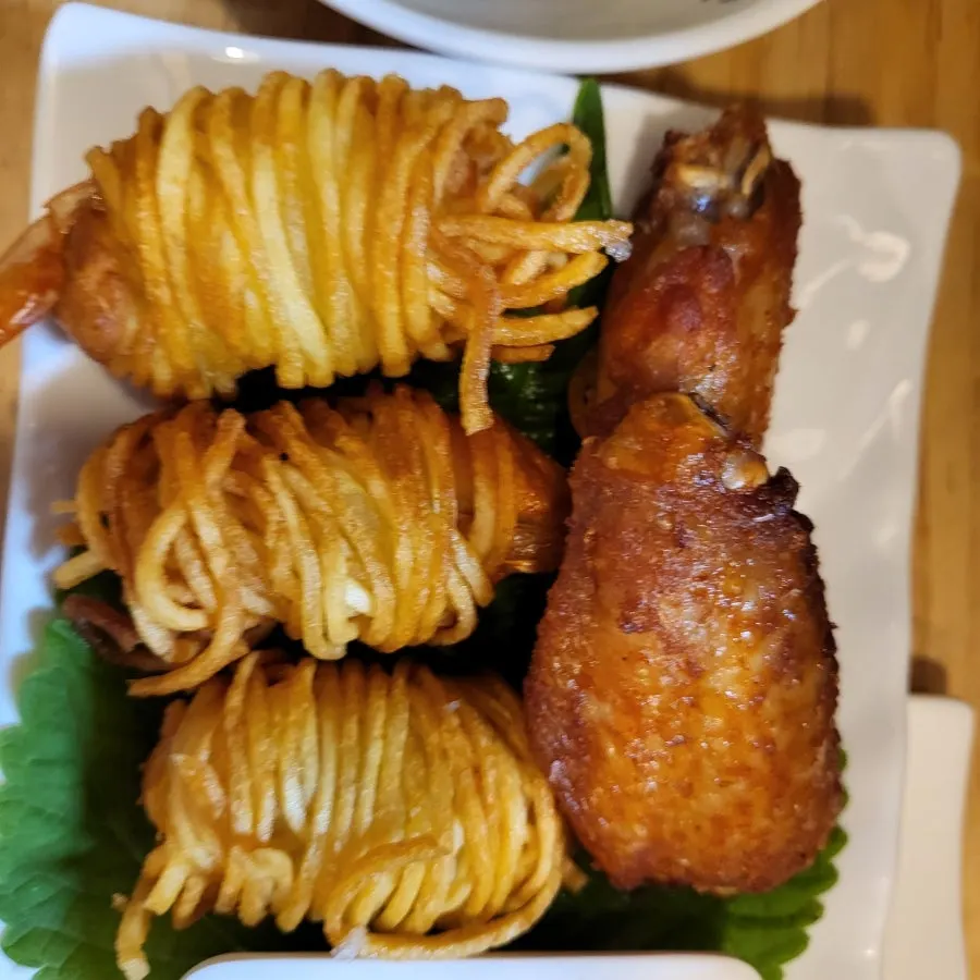 Plate of fried side dishes served with sauce