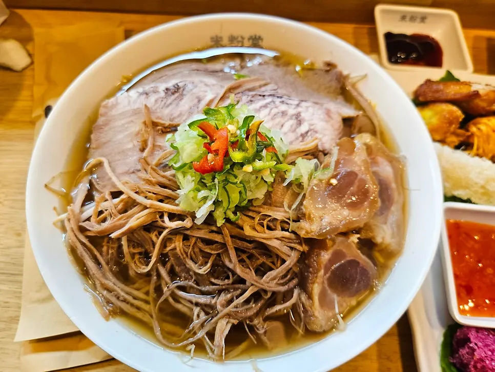 Bowl of pho piled high with meat