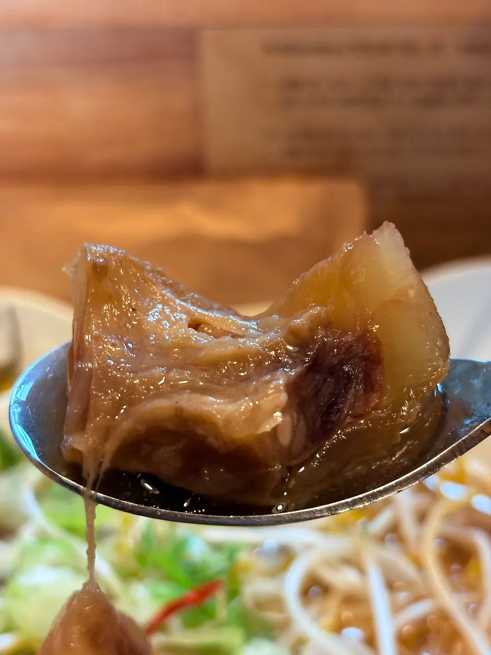 A spoonful of the rich meat broth