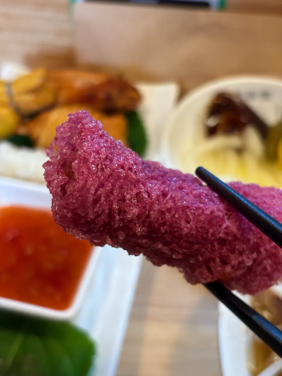 Cross-section of a sweet potato spring roll filled with mashed sweet potato