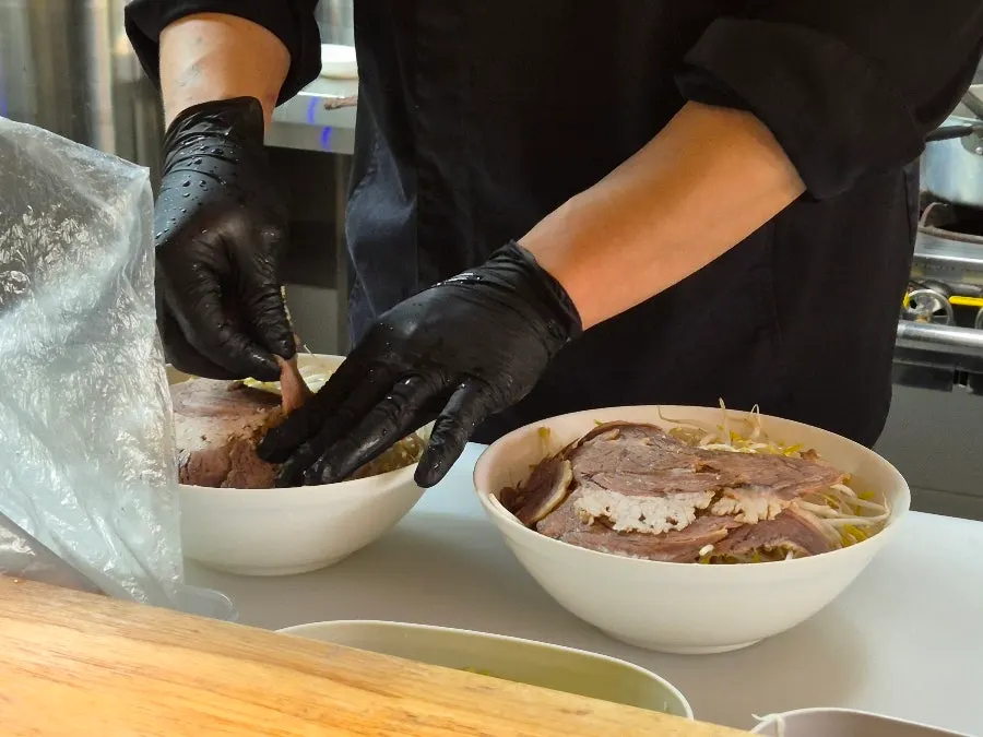 Pho cooking process visible right in front of the customer