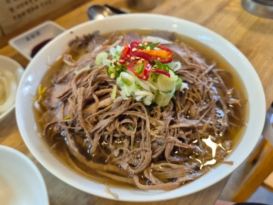 A spoonful of pho broth
