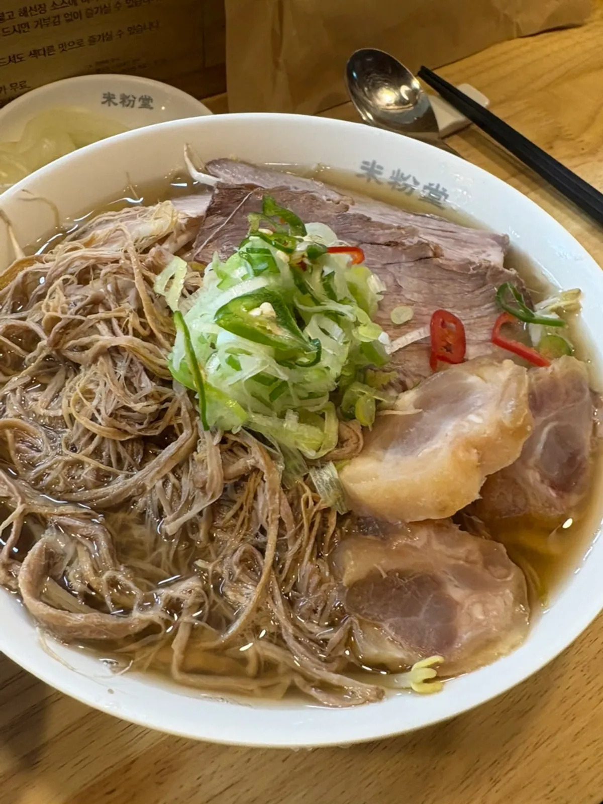 Close-up of the brisket and tendon pho