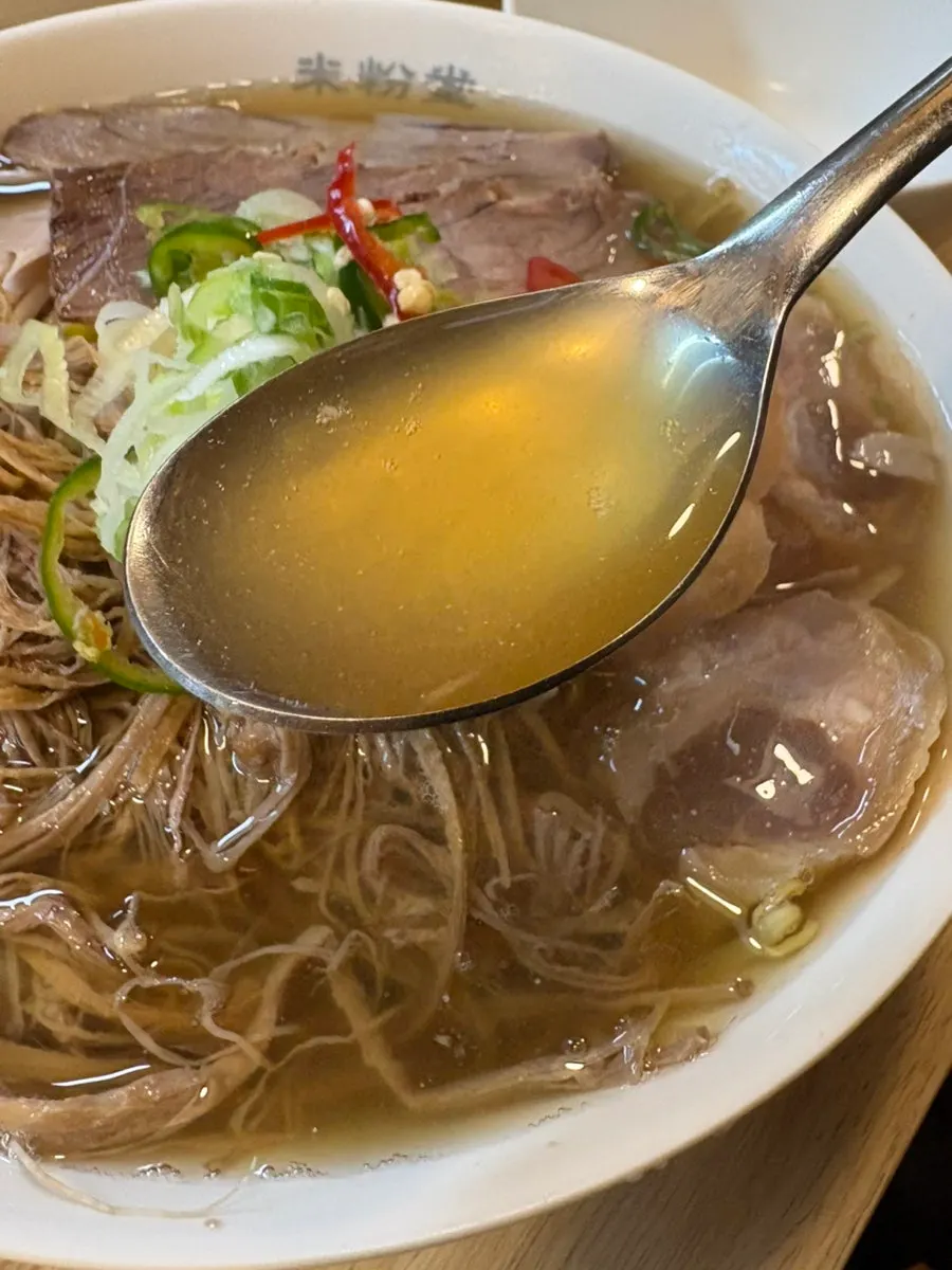 A spoonful of pho broth