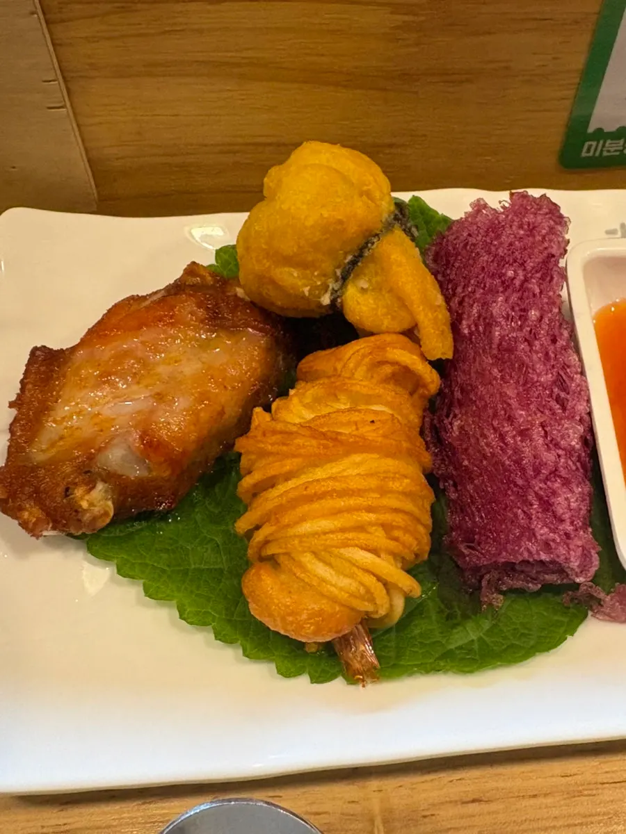Buffalo wings and wedding shumai on the assorted platter