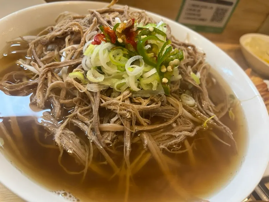 Pho bowl loaded with bean sprouts and meat