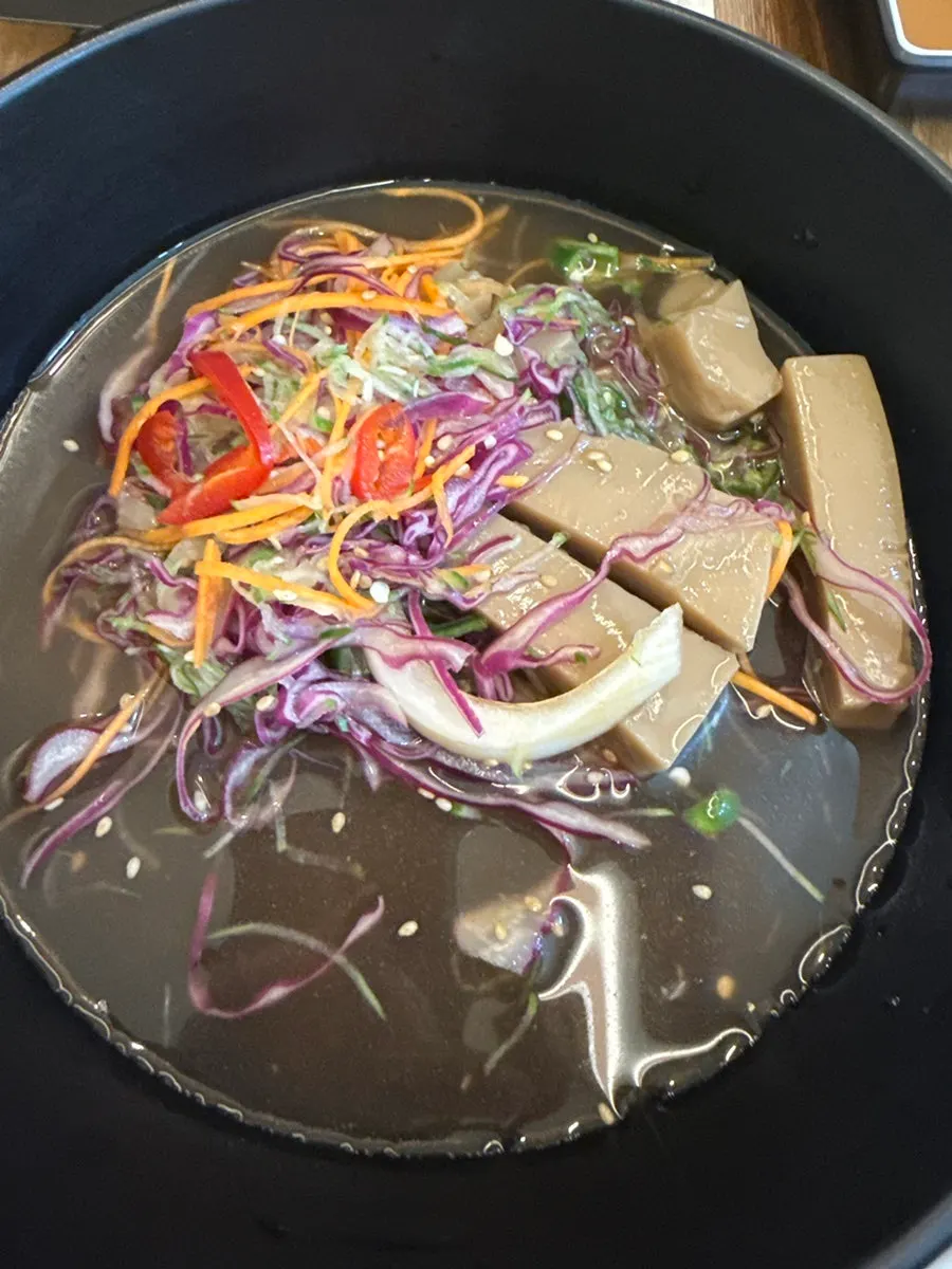Rice cooker, raw eggs, and seaweed flakes for fried rice