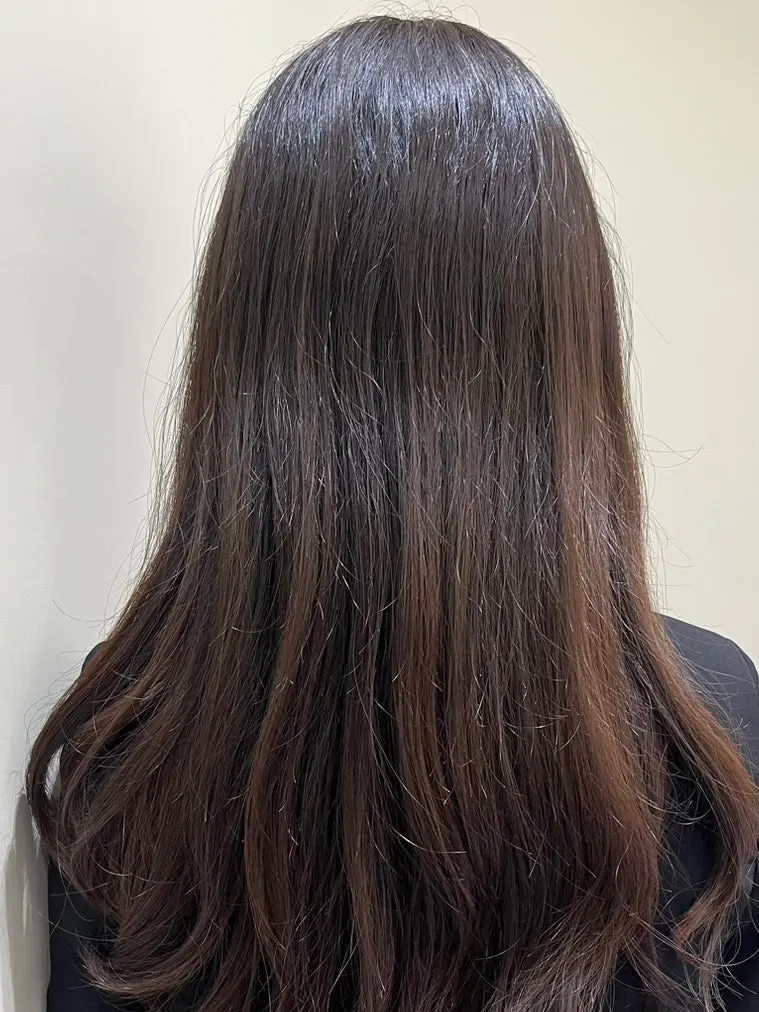 Hair before dyeing, showing uneven, stained sections