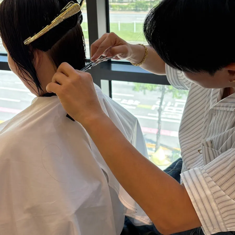 Face-shape-matched short cut in progress