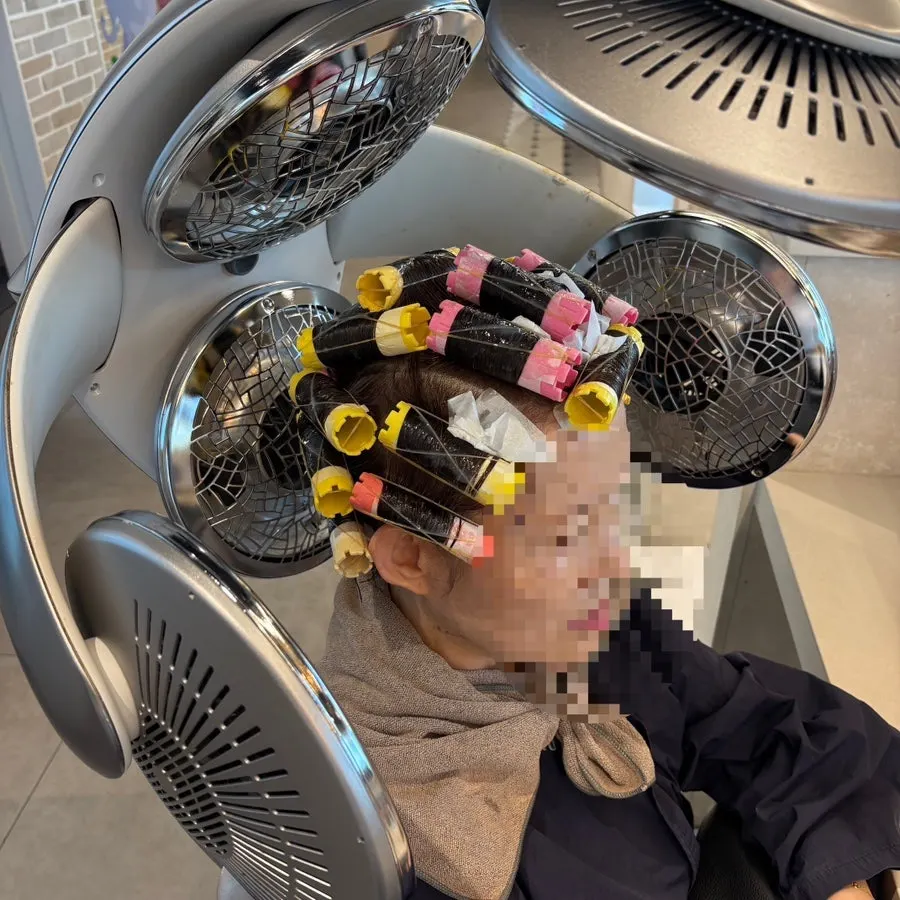 Back hair tightly wound with perm rods