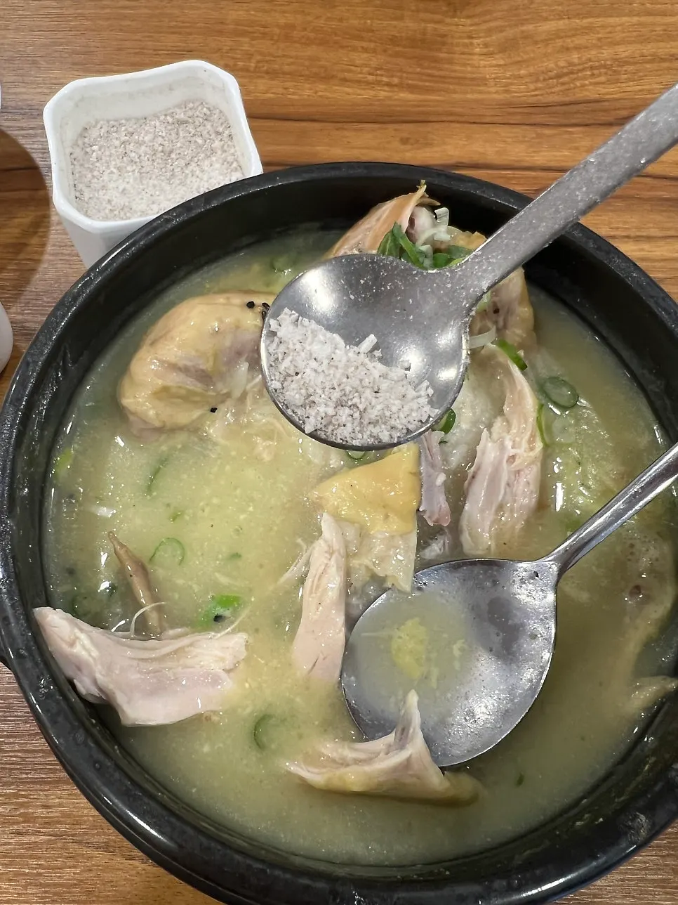 Samgyetang broth seasoned to taste with added salt