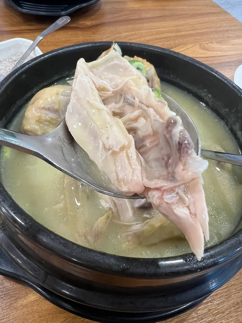 A bowl of samgyetang eaten with the broth