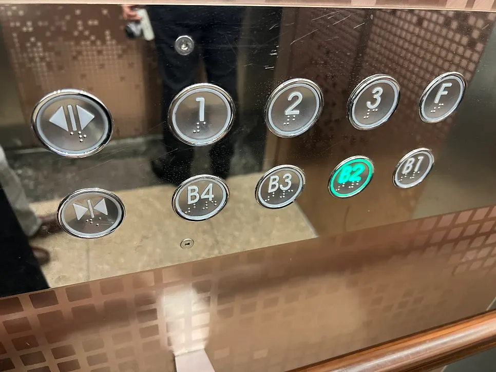 Elevator button panel showing underground parking floors