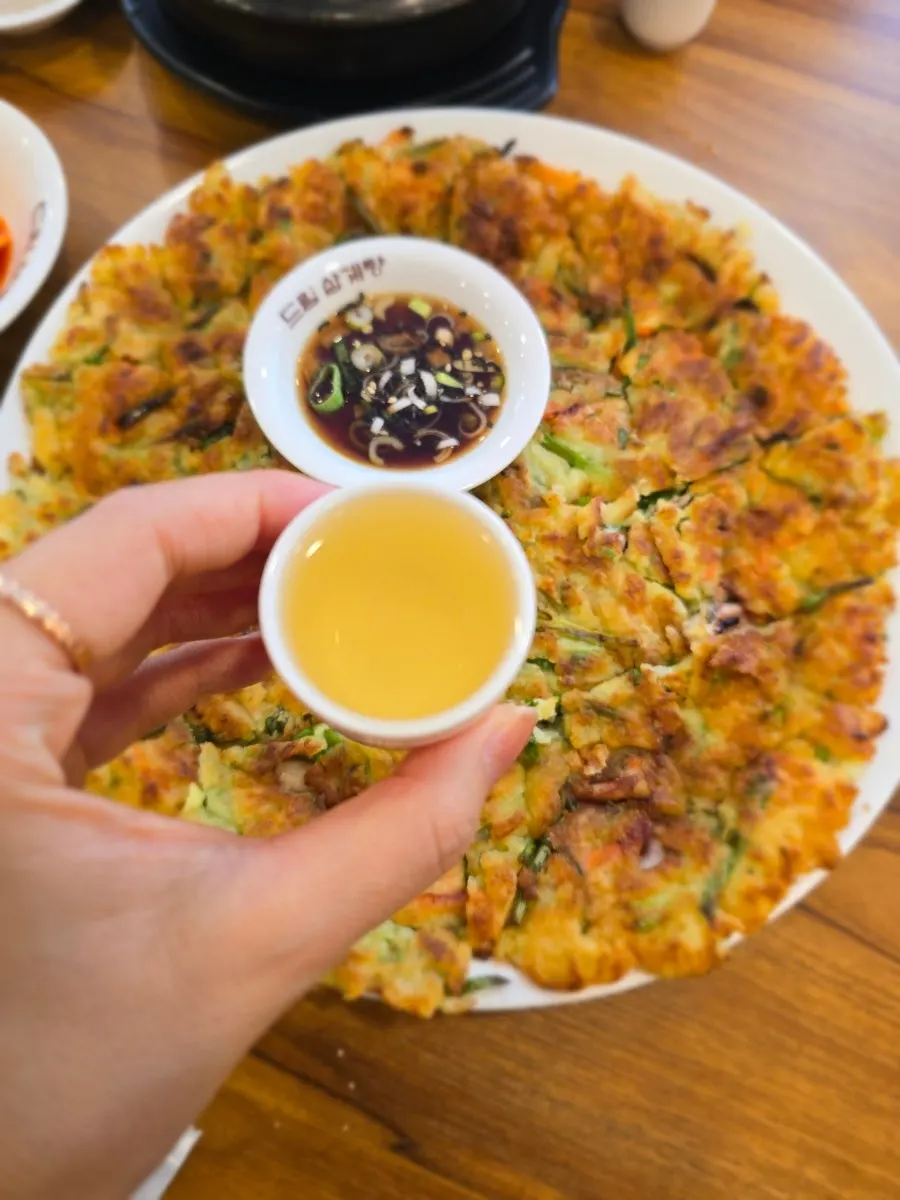 Ginseng liquor served alongside the seafood pancake