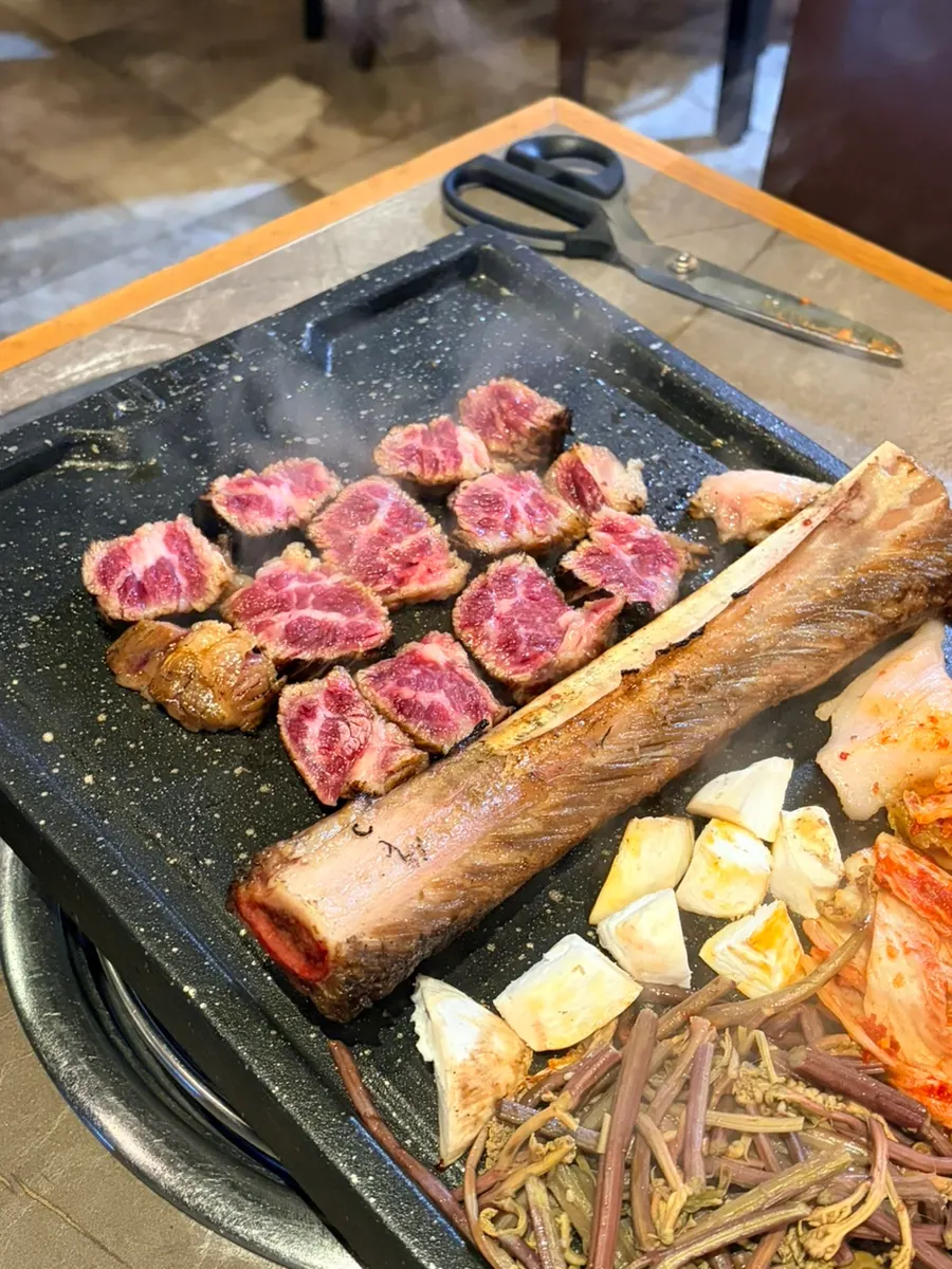 Prime beef ribs grilled by a staff member
