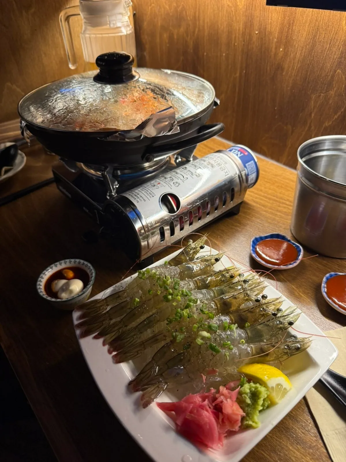 Raw shrimp sashimi served with soy sauce