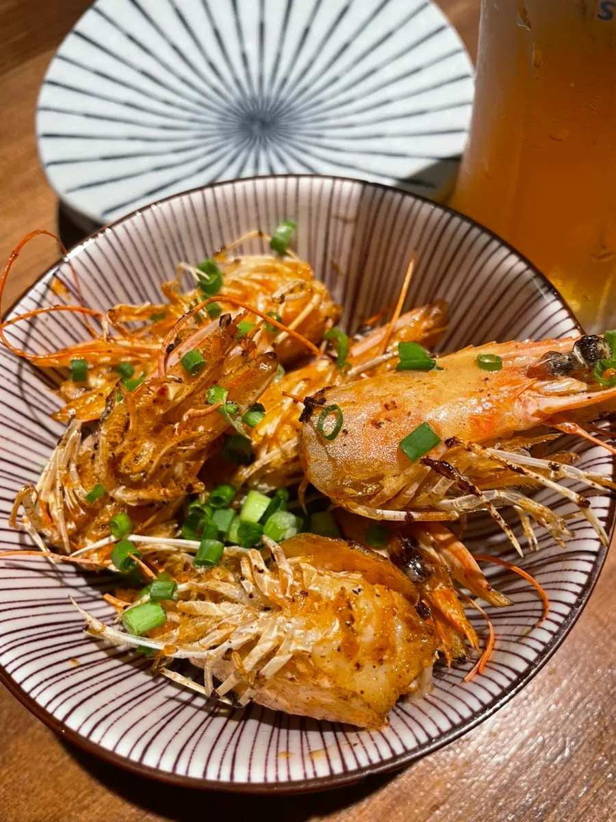 Butter-grilled shrimp heads cooked nutty and golden