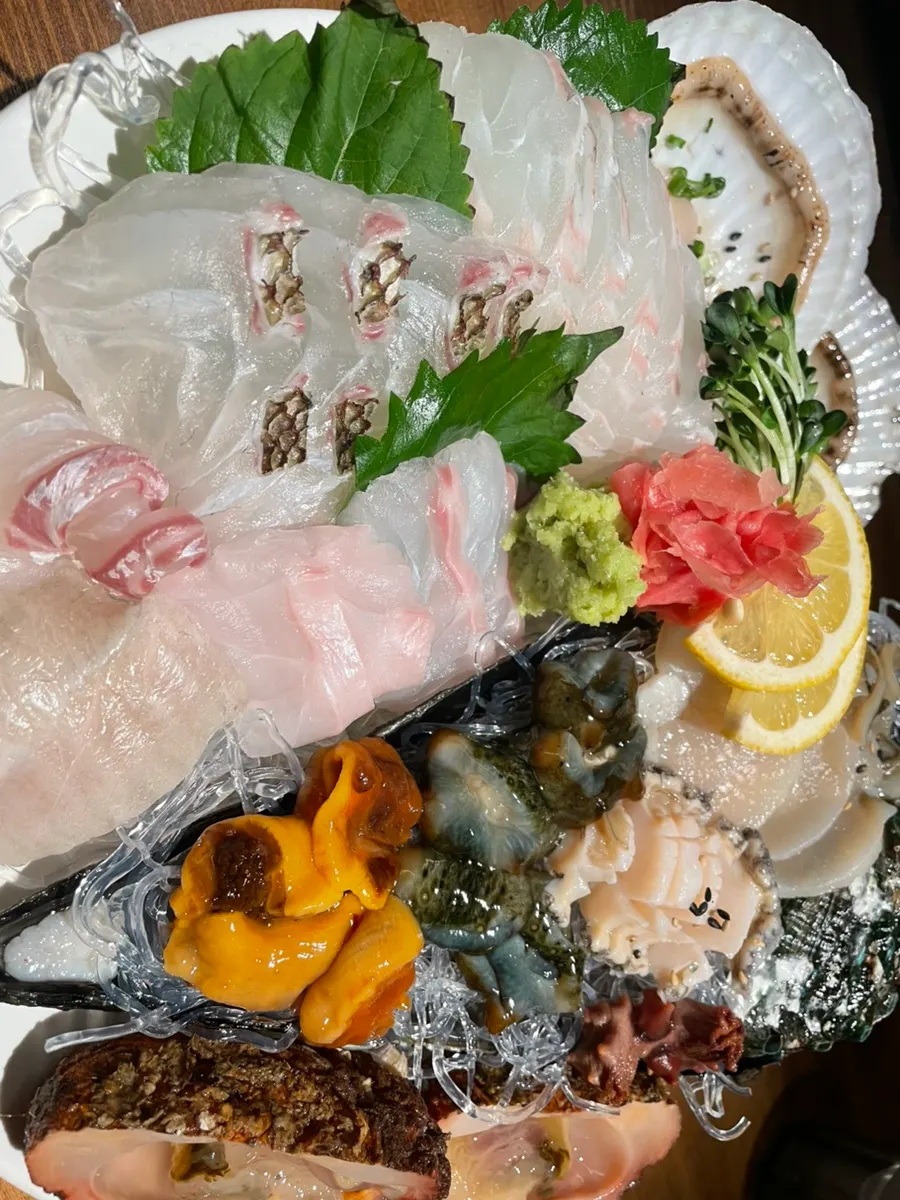 Generous mix of sashimi and seafood on one plate