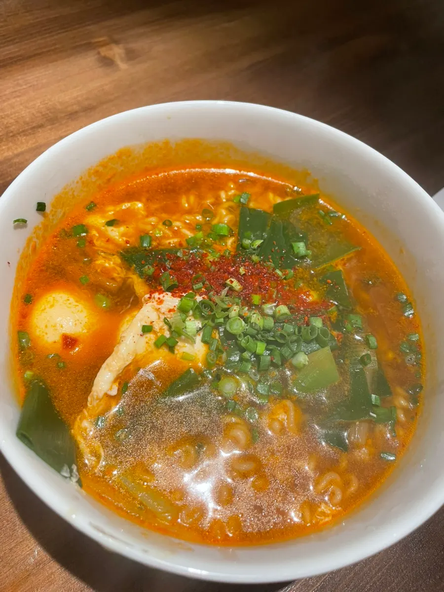 Gyeduymyeon ramyeon topped with egg and scallions