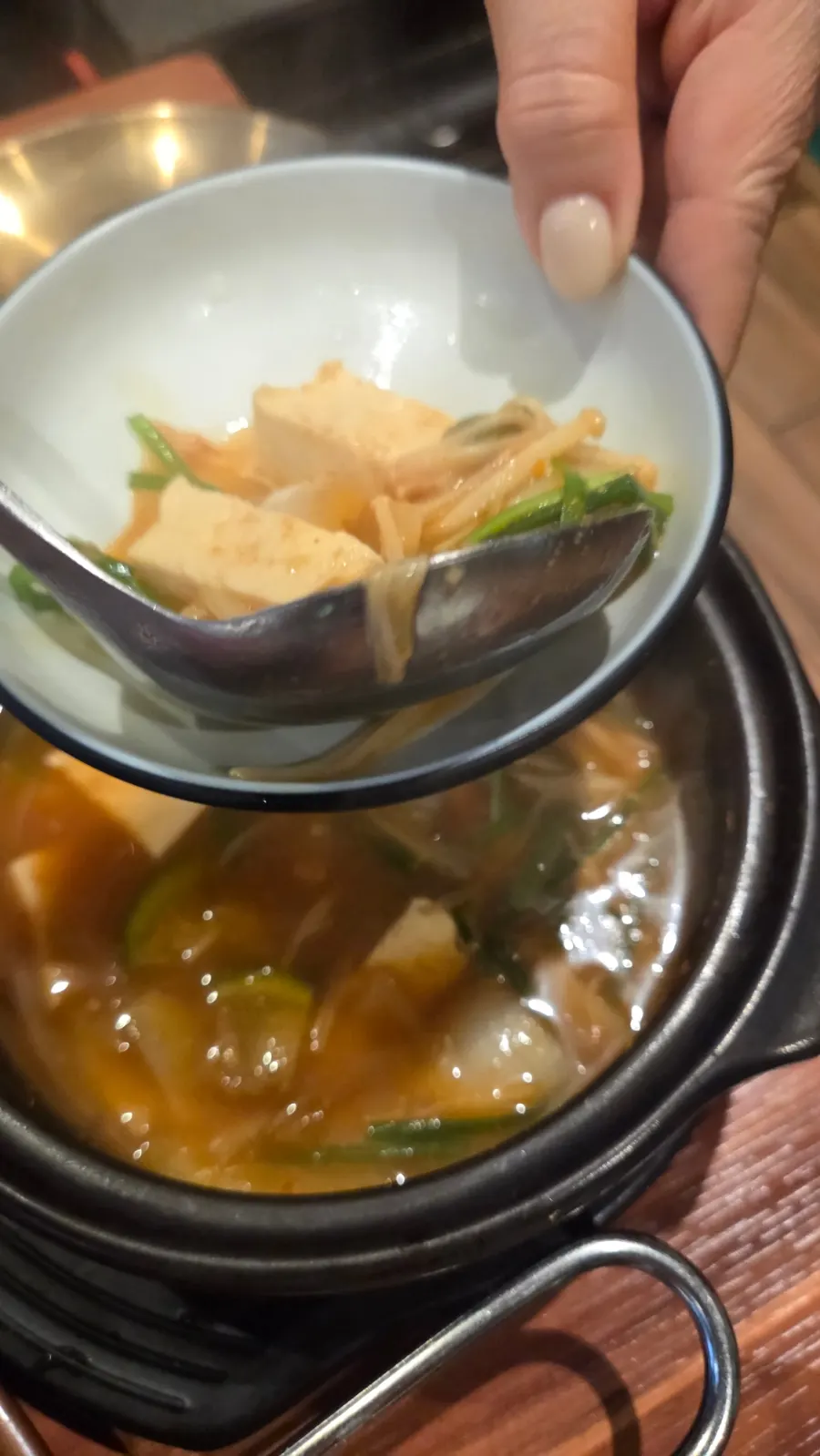 Doenjang jjigae and stone-plate kkakdugi fried rice table setting
