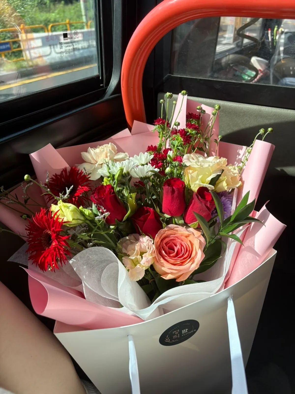 Reserved bouquet with red and pink flowers