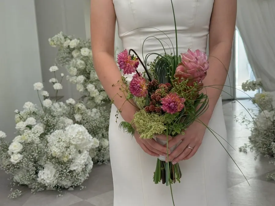 A wedding-shoot scene featuring the fingertips