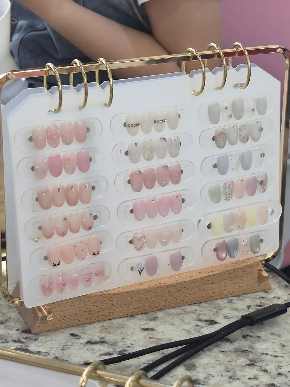 Nail design samples displayed in the shop
