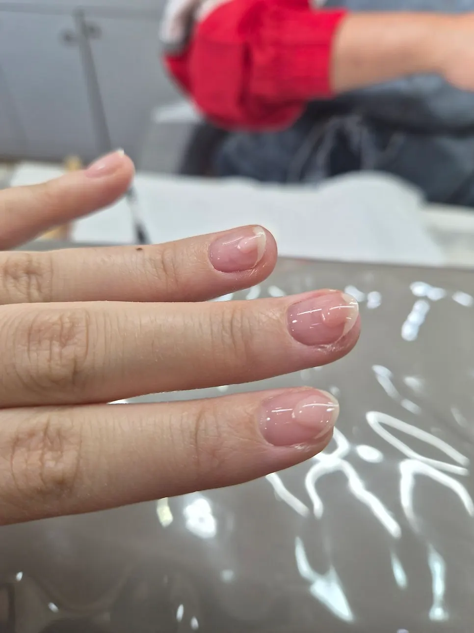 Men's nail care being done at the same time
