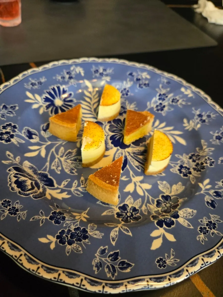 Seasonal dessert of orange jelly and raspberries