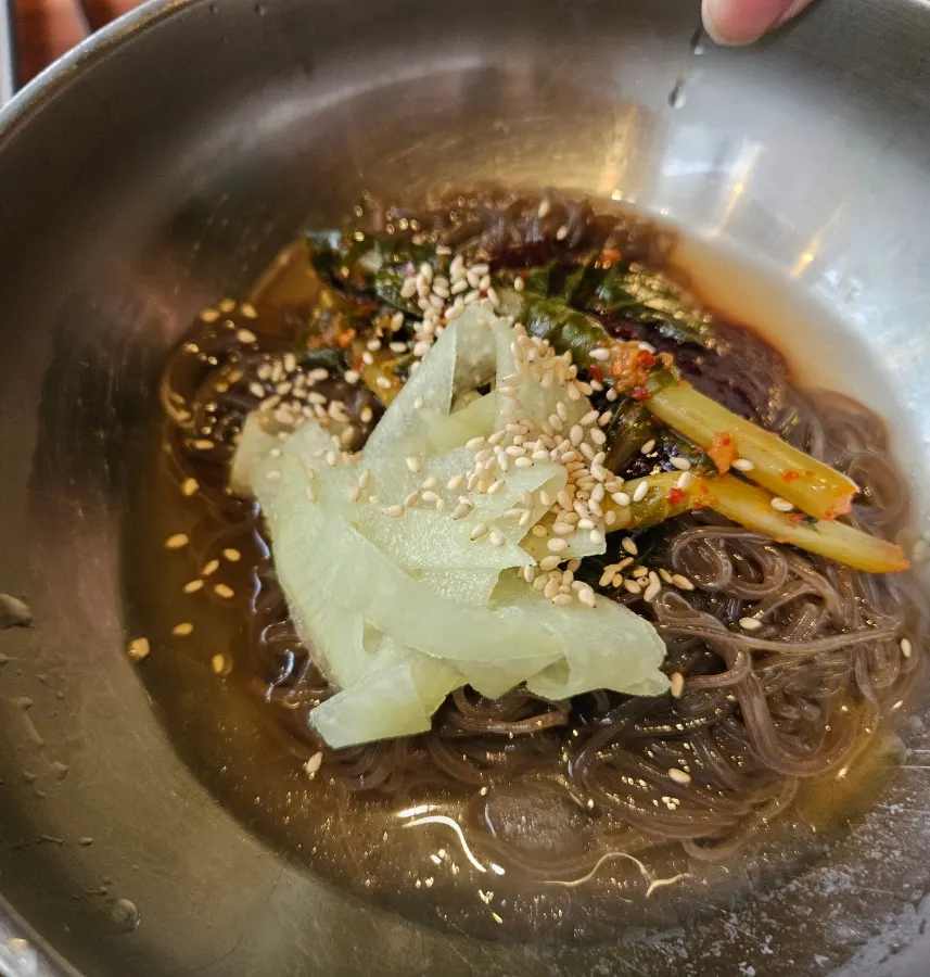 Dessert yeolmu bibim naengmyeon topped with young radish kimchi and radish