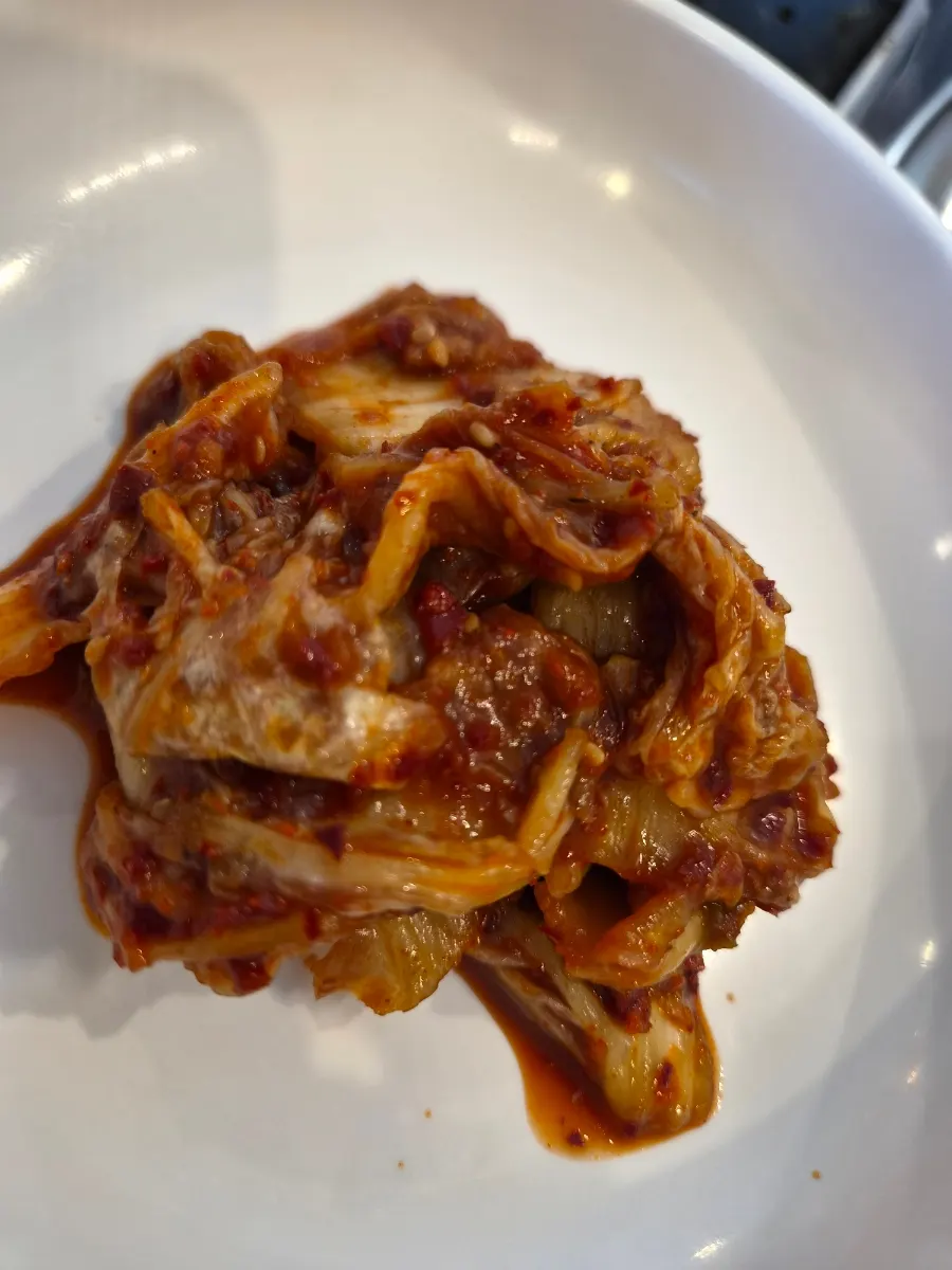 Kimchi served alongside the kalguksu
