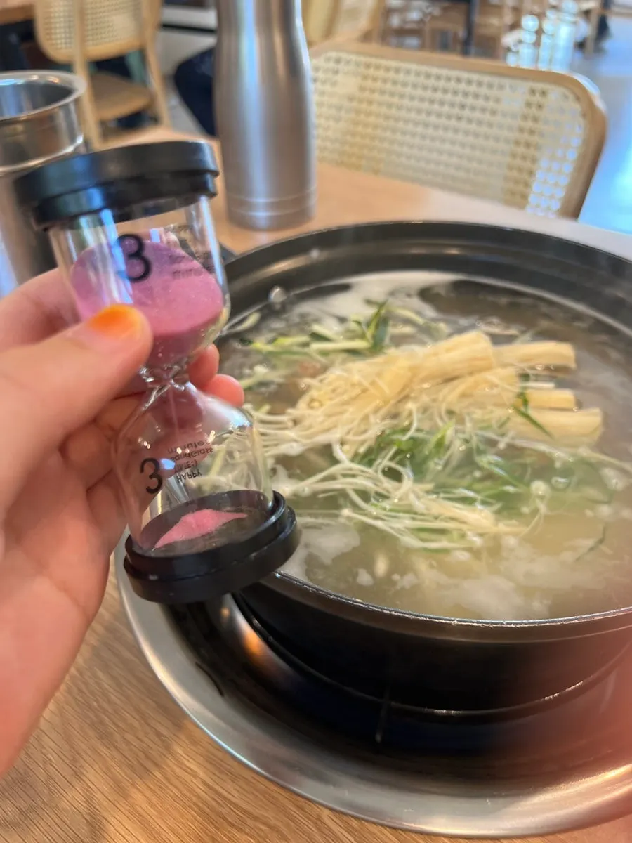 Close-up of the kalguksu pot topped with seafood