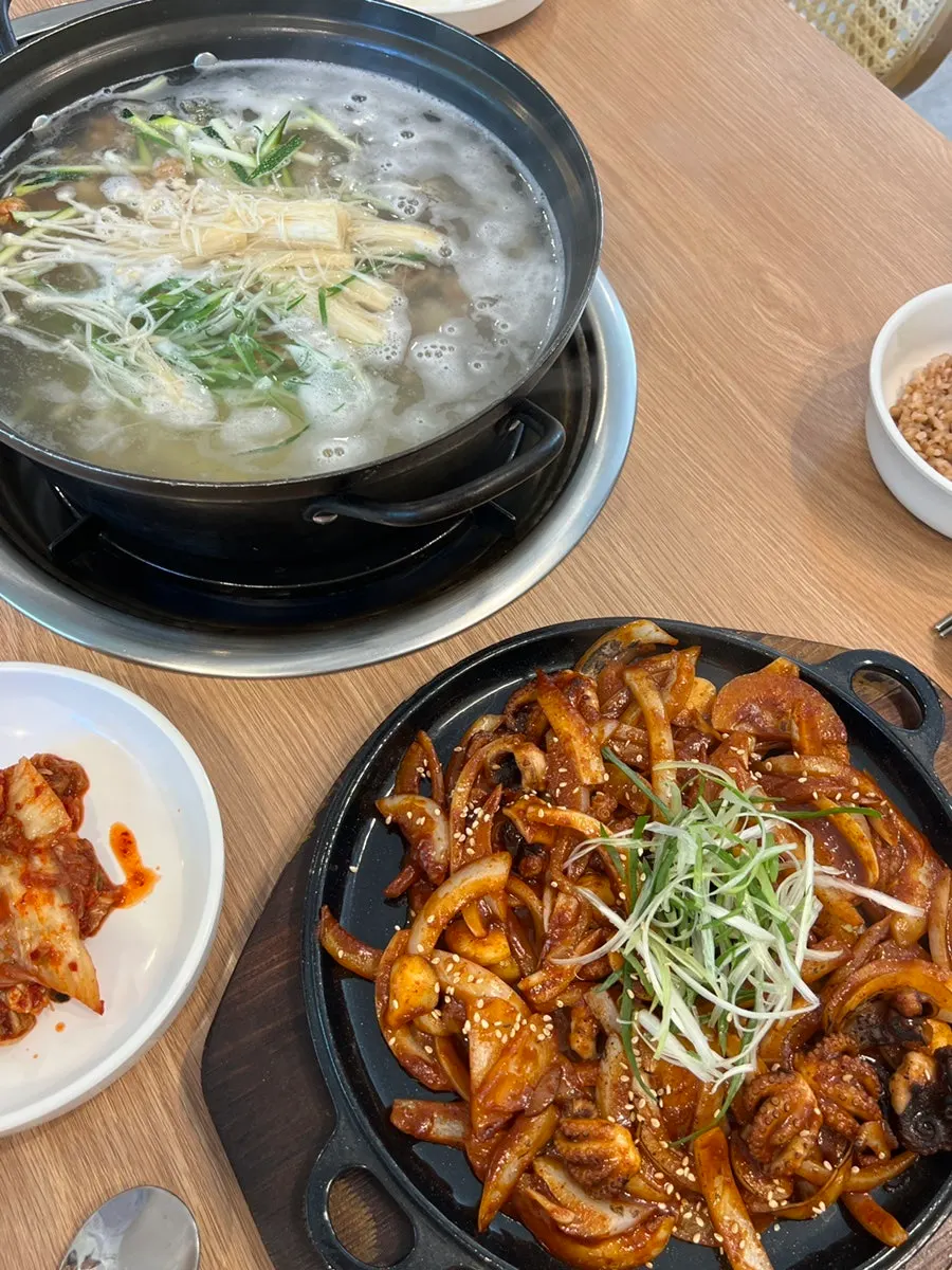 A table set with both kalguksu and octopus