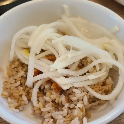 Close-up of barley rice and side dishes