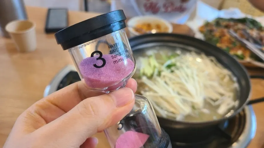 3-minute hourglass on the table
