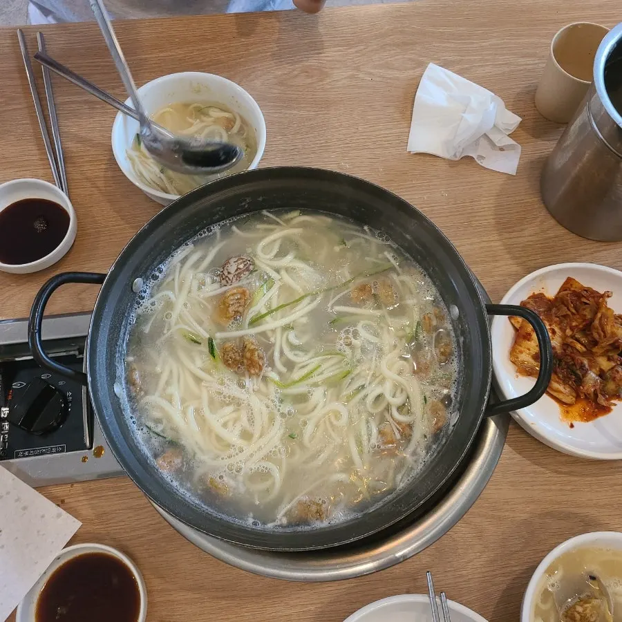Yubok haemul kalguksu with clams and mideodeok in pufferfish broth