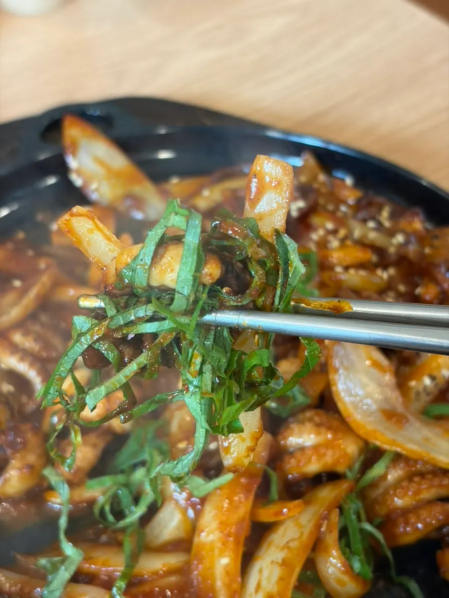 Table spread with kalguksu and stir-fried octopus together