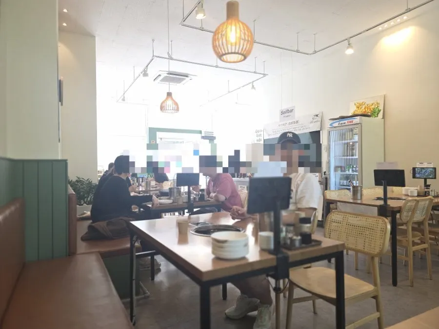 Interior of the restaurant still busy during a late lunch hour