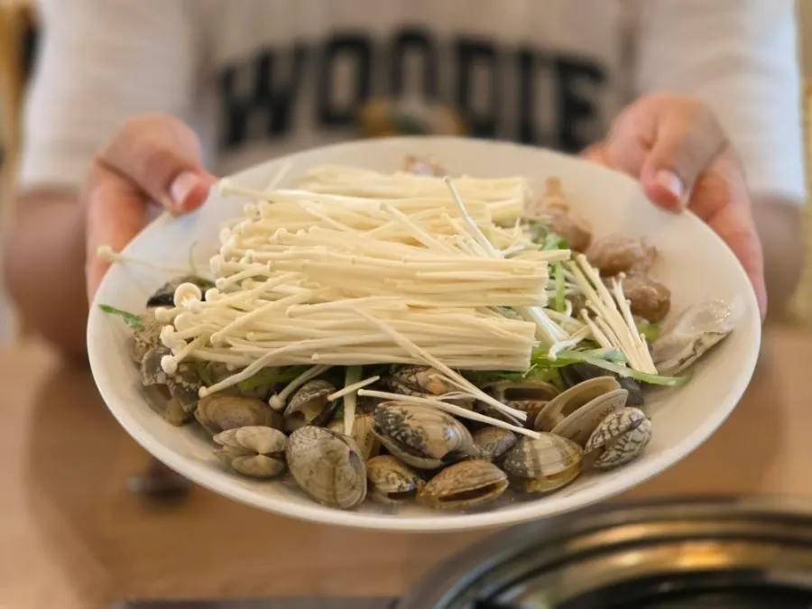 Table set with seafood kalguksu ingredients