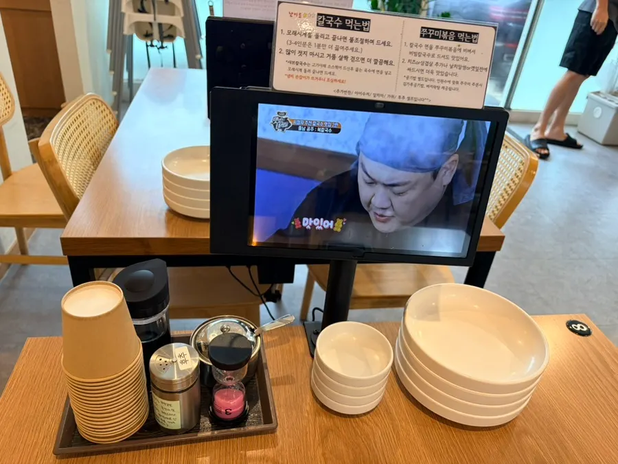 Tablet ordering and an hourglass on the table
