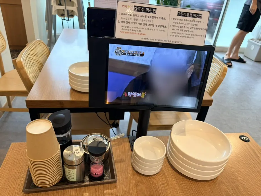 Tablet ordering and an hourglass on the table