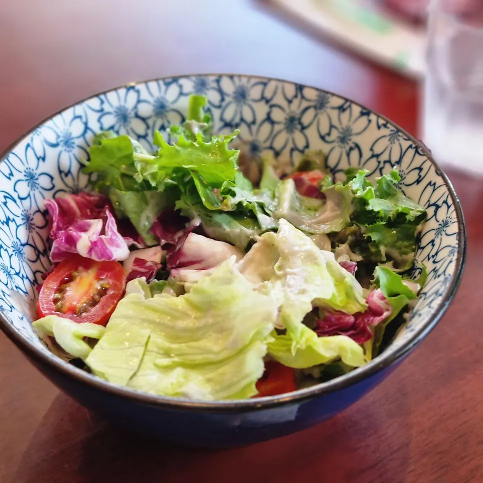 Bowl of rice served alongside minari dishes