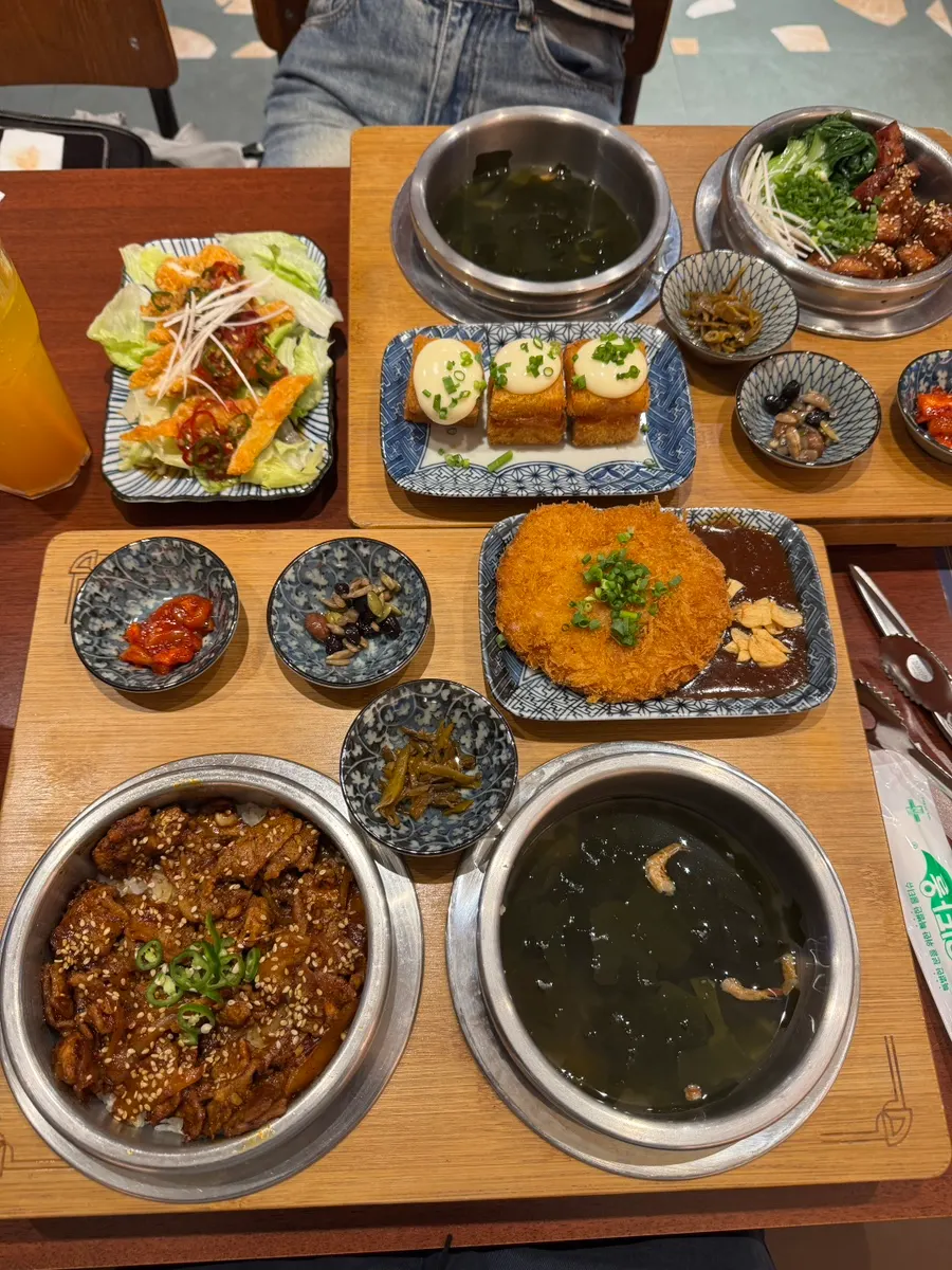 Table spread with the ordered pot rice and side dishes
