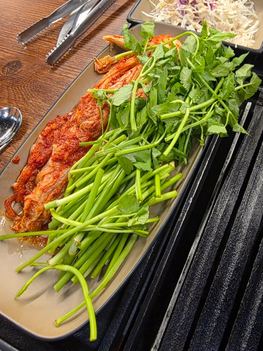 Kimchi and water celery grilled together with the meat