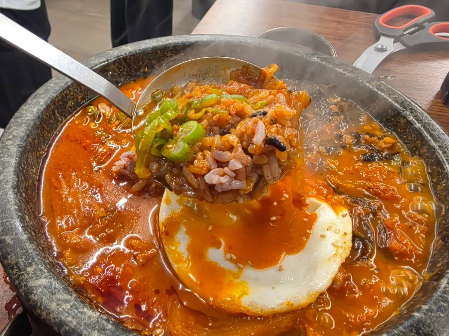 Cross-section of kimchi rice showing the black rice inside