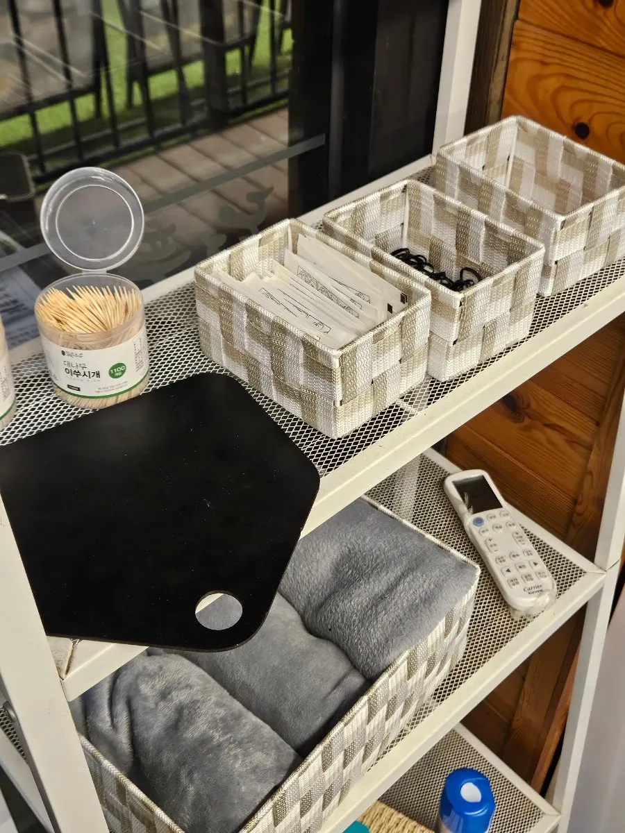Hair ties, blankets, and dental floss set out by the entrance