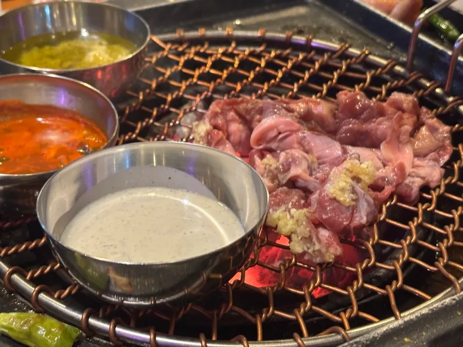 Sundae and king oyster mushrooms cooking on the same grill