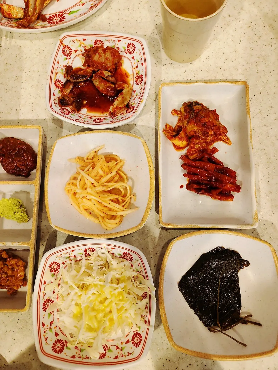 Table set with basic sauces and side dishes for the meat